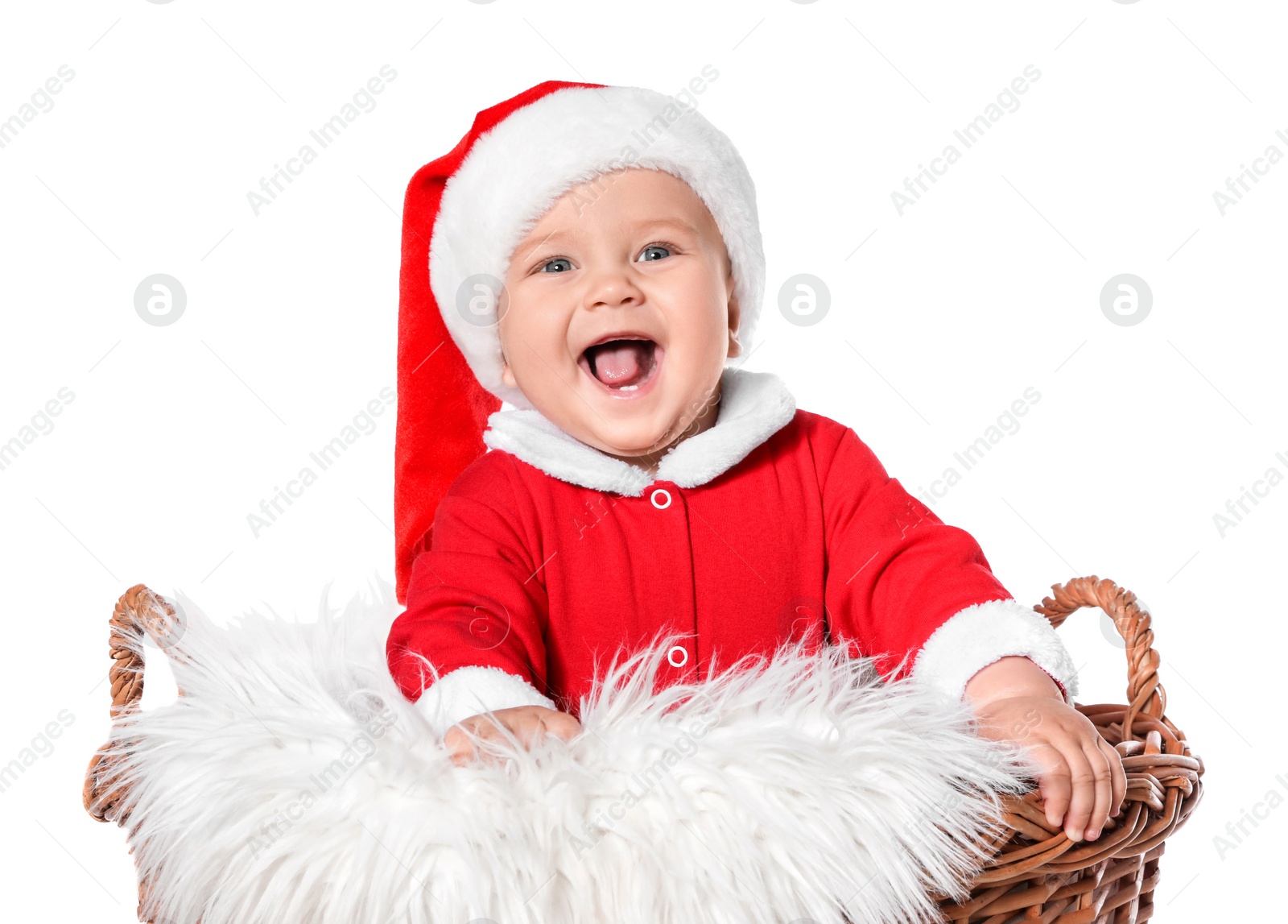 Photo of Cute baby in wicker basket on white background. Christmas celebration