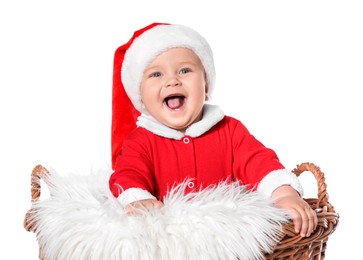 Cute baby in wicker basket on white background. Christmas celebration