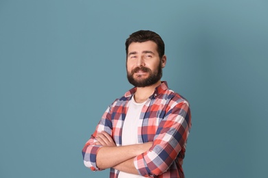 Photo of Portrait of confident mature man on color background