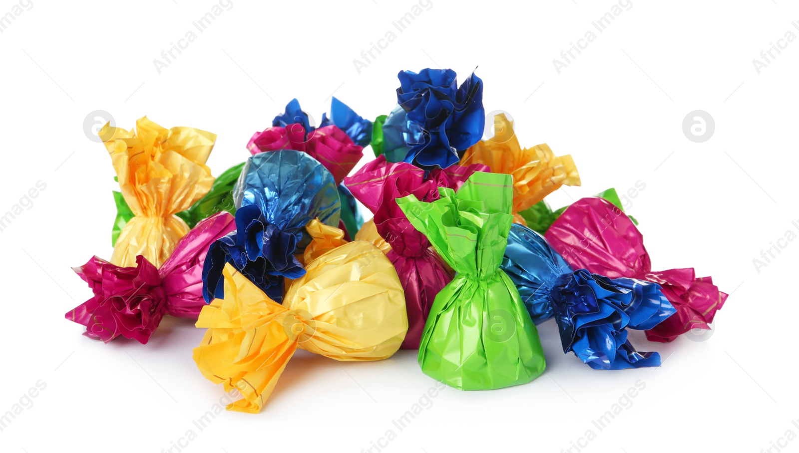 Photo of Delicious candies in colorful wrappers on white background