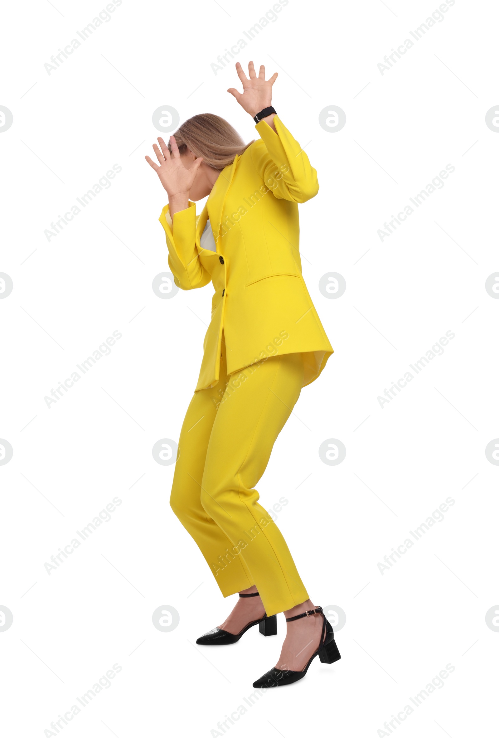 Photo of Businesswoman in suit avoiding something on white background