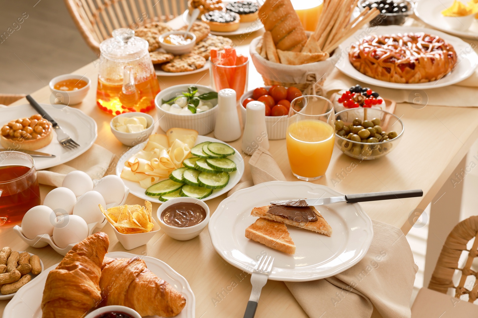 Photo of Dishes with different food on table indoors. Luxury brunch