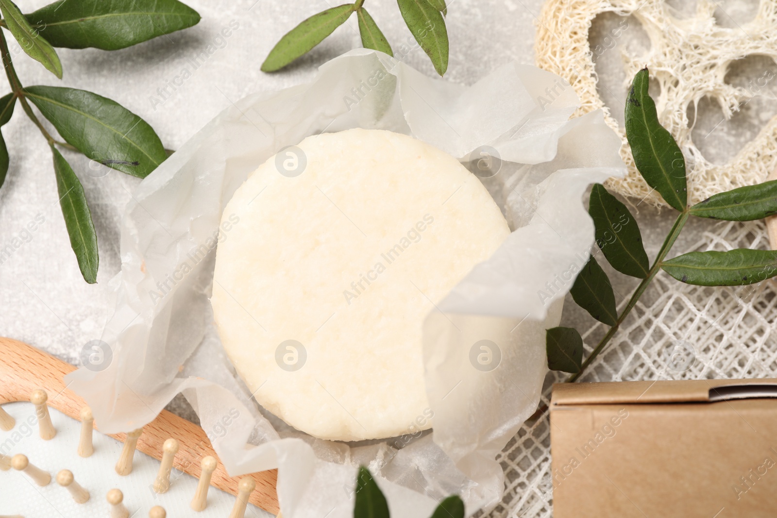 Photo of Flat lay composition with solid shampoo bars on light grey table