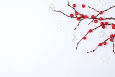 Photo of Winter composition with decorative branches on white background, top view