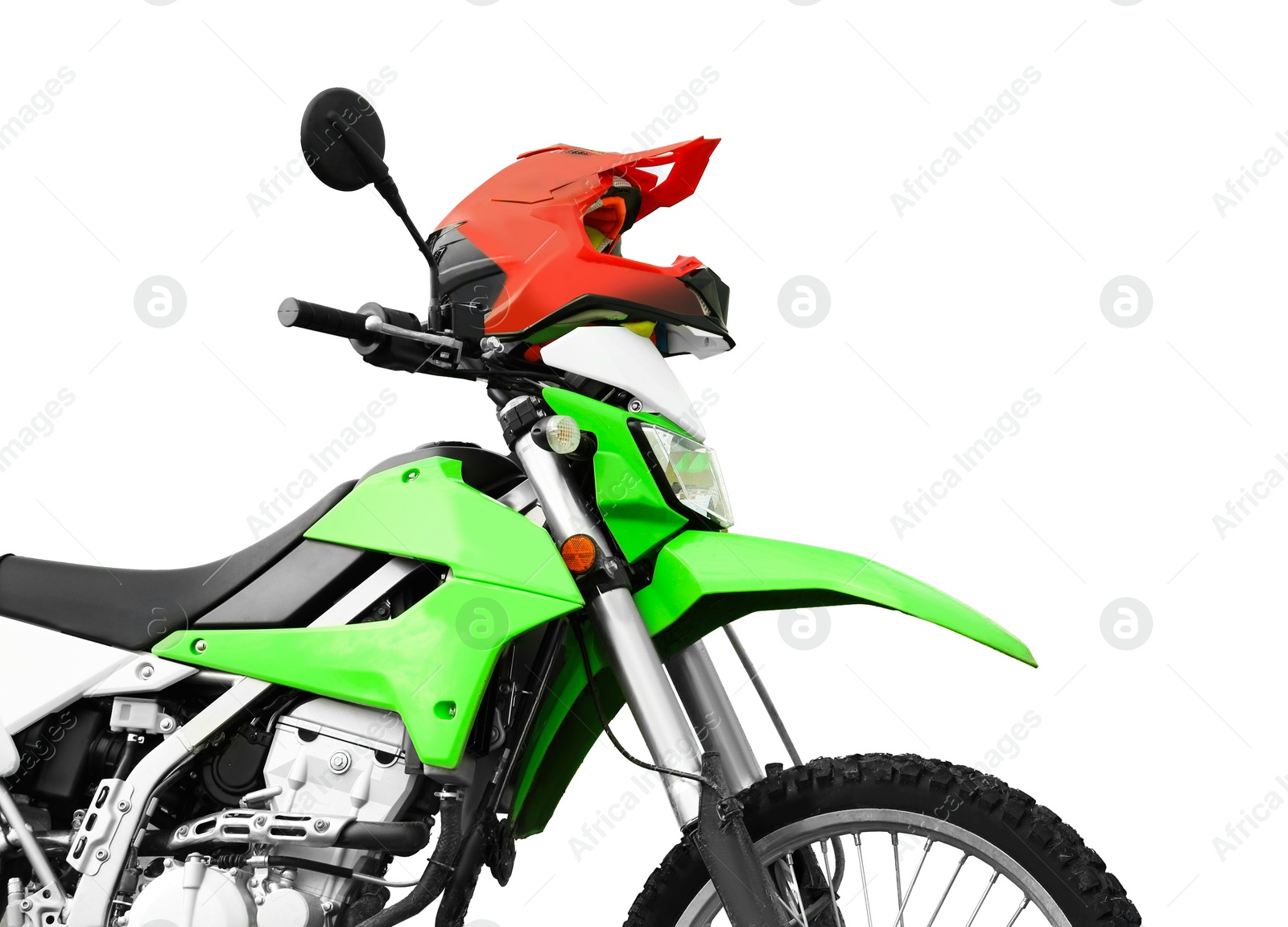 Image of Stylish green cross motorcycle and helmet on white background, closeup