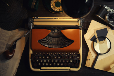 Photo of Flat lay composition with vintage detective items on dark wooden background