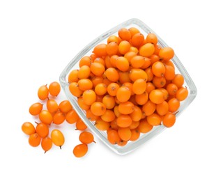 Photo of Bowl with fresh ripe sea buckthorn berries on white background, top view