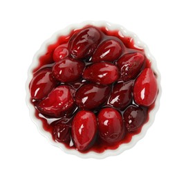 Delicious dogwood jam with berries in bowl isolated on white, top view