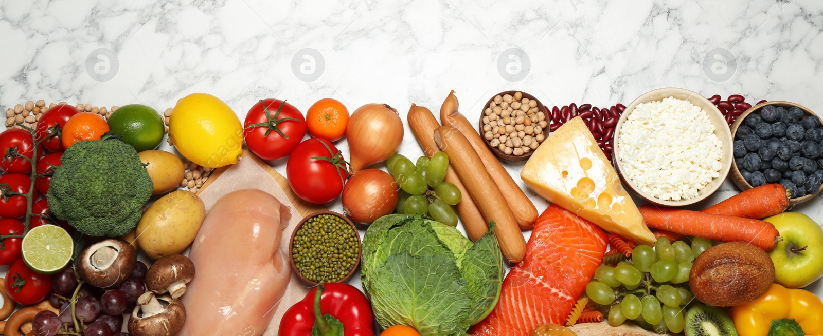 Photo of Different products on white marble table, top view with space for text. Healthy food and balanced diet