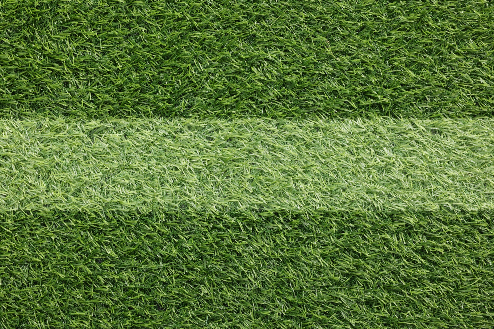 Image of Green grass with white marking, top view