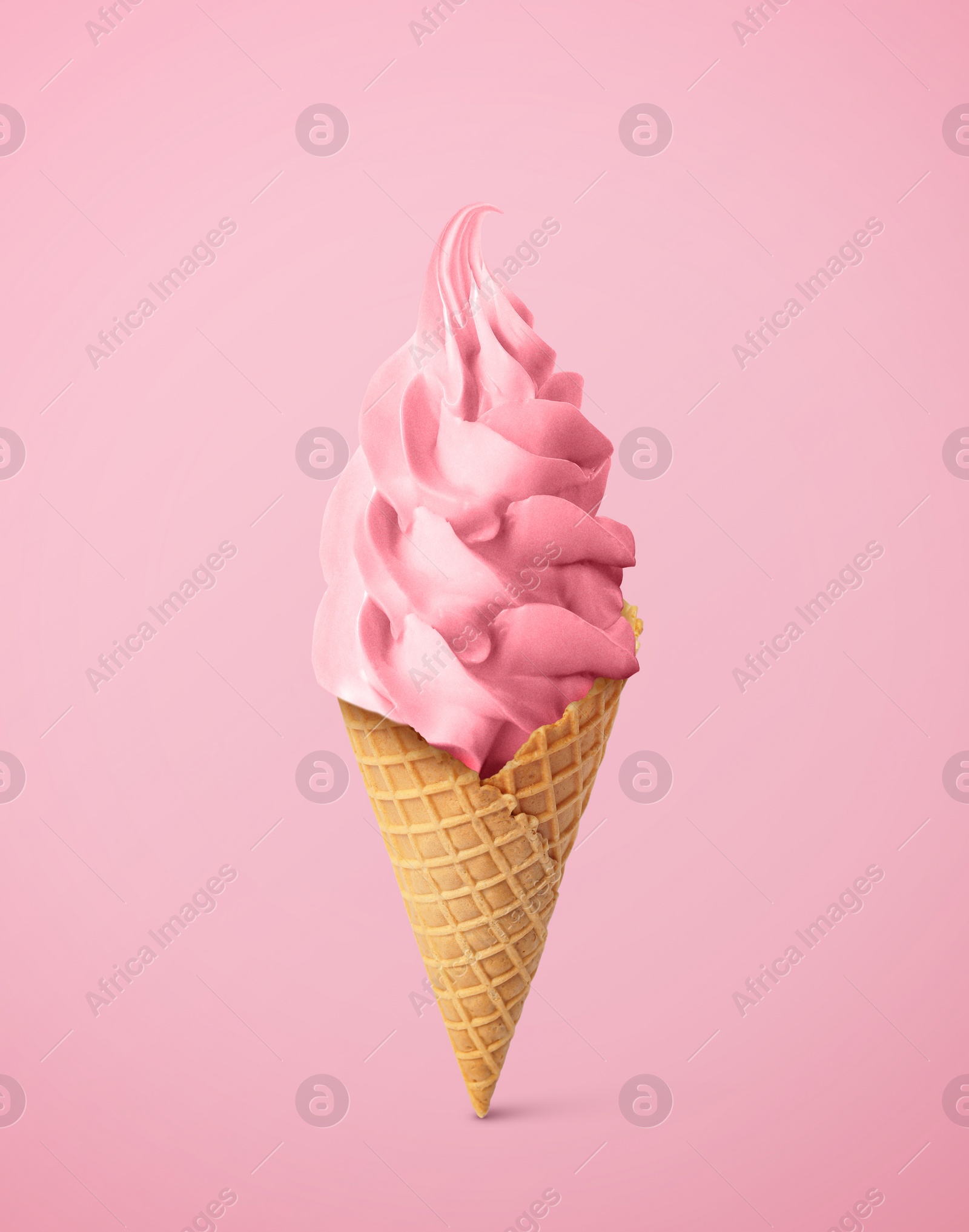 Image of Tasty raspberry or strawberry ice cream in waffle cone on pastel pink background. Soft serve