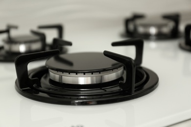 Modern built-in gas cooktop, closeup. Kitchen appliance