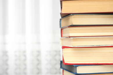 Photo of Collection of different books indoors, closeup. Space for text