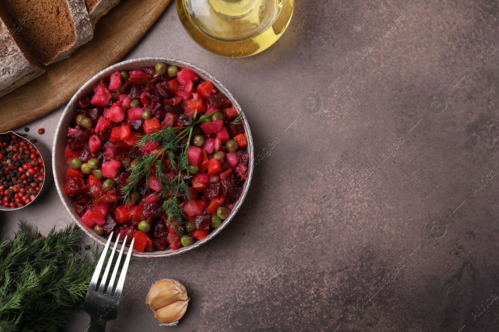 Photo of Delicious vinaigrette salad on grey table, flat lay. Space for text