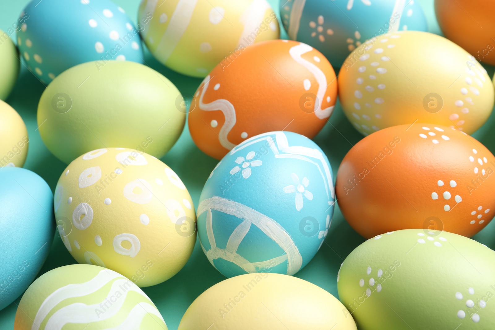 Photo of Many beautiful painted Easter eggs as background, closeup