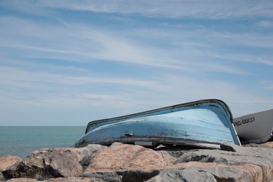 Light blue boat near sea on sunny day