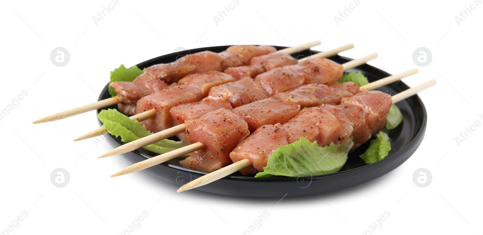 Photo of Wooden skewers with cut raw marinated meat isolated on white