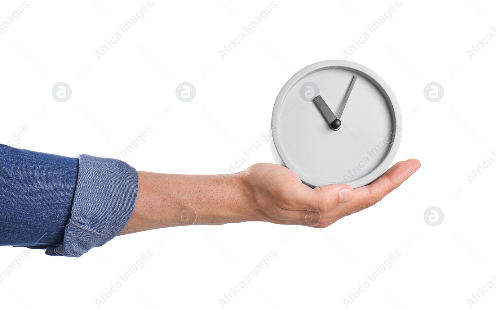 Photo of Young man holding clock on white background. Time management