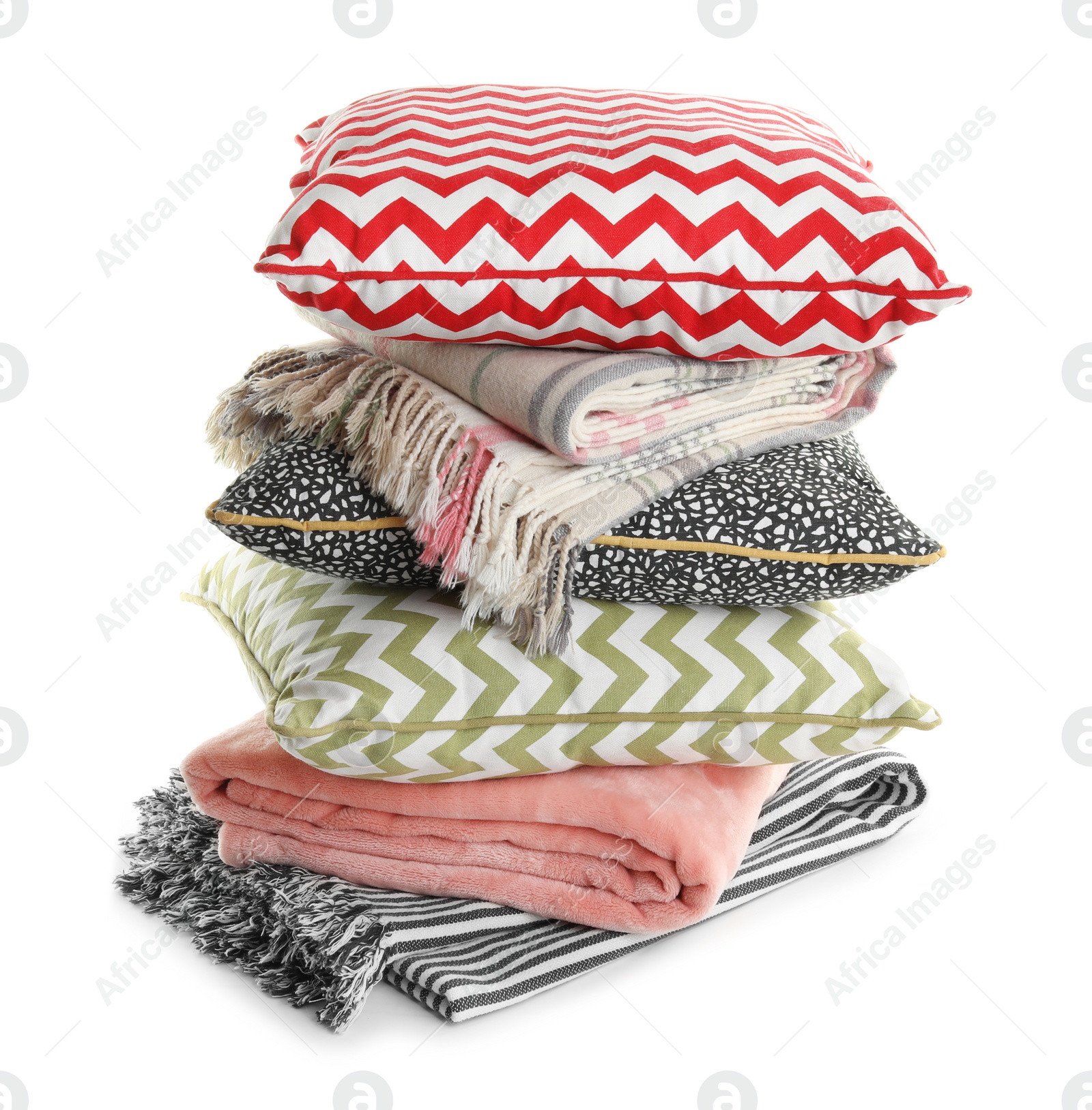 Photo of Stylish soft pillows and folded plaids on white background