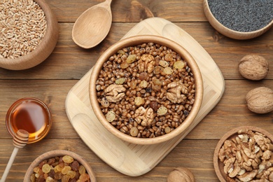 Traditional Christmas slavic dish kutia served on wooden table, flat lay