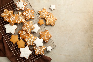 Tasty Christmas cookies with icing on light table, flat lay. Space for text