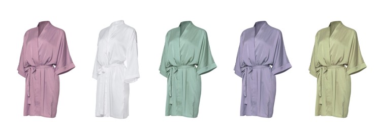 Set of different color silk bathrobes on white background