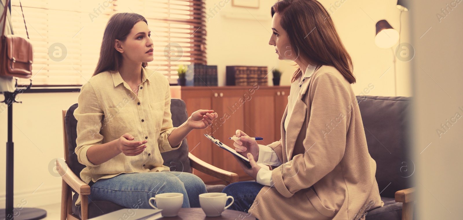 Image of Professional psychotherapist working with patient in office. Banner design