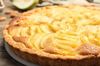 Delicious sweet pear tart on table, closeup