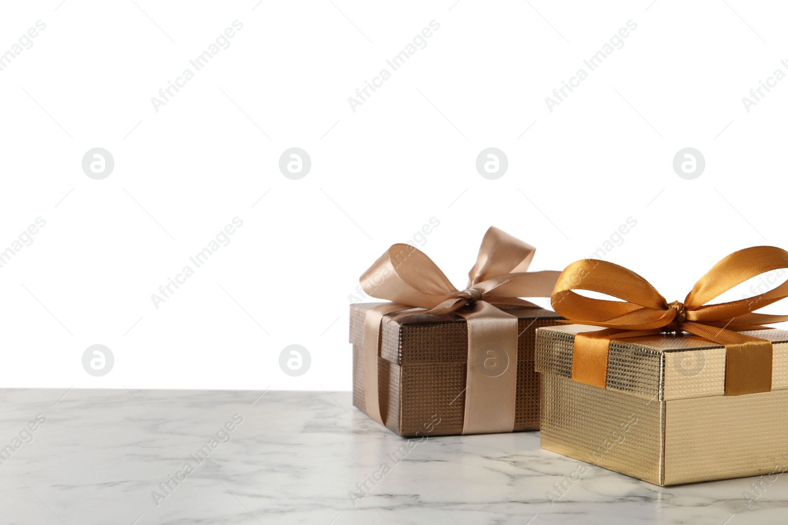 Photo of Two beautiful gift boxes on white marble table. Space for text