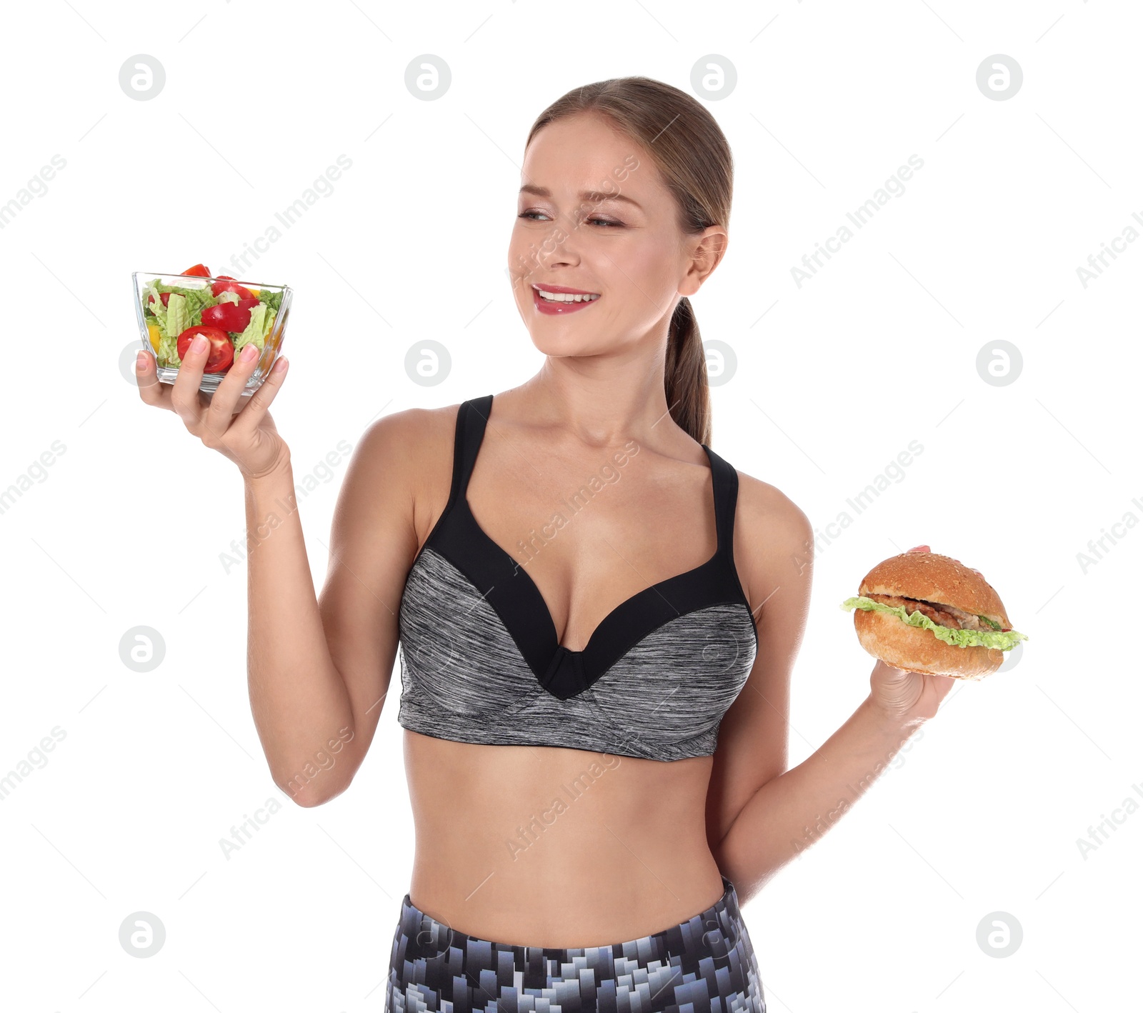 Photo of Slim woman with burger and salad on white background. Healthy diet