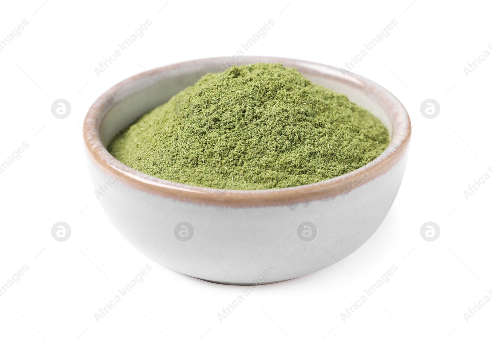 Photo of Wheat grass powder in bowl isolated on white