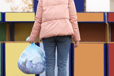 Woman with garbage bag at recycling point outdoors, closeup