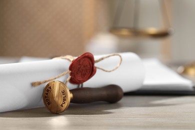 Image of Public notary. Document with wax stamp on wooden table, closeup