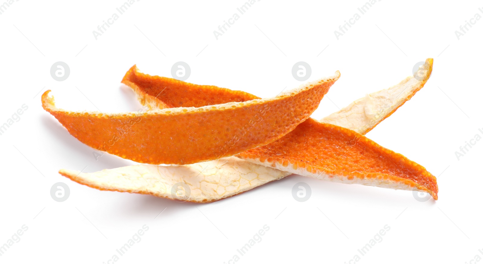 Photo of Dry orange fruit peels on white background