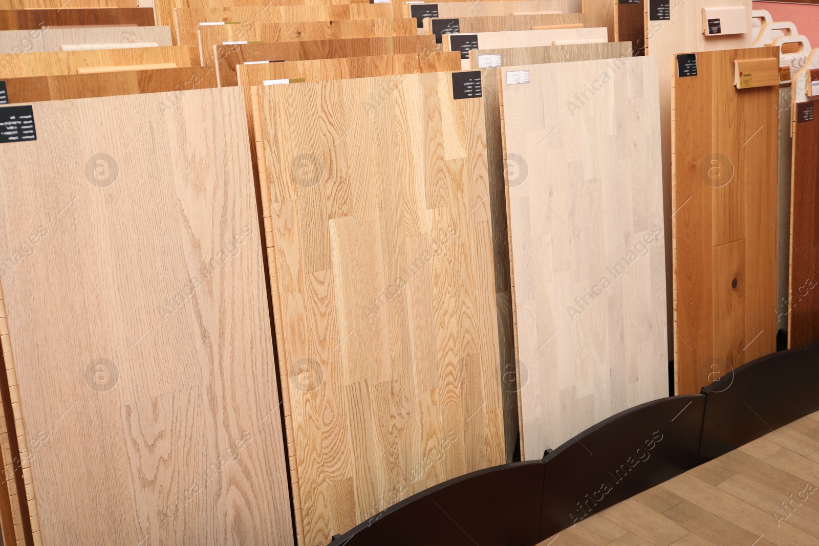 Photo of Many different samples of wooden flooring in store