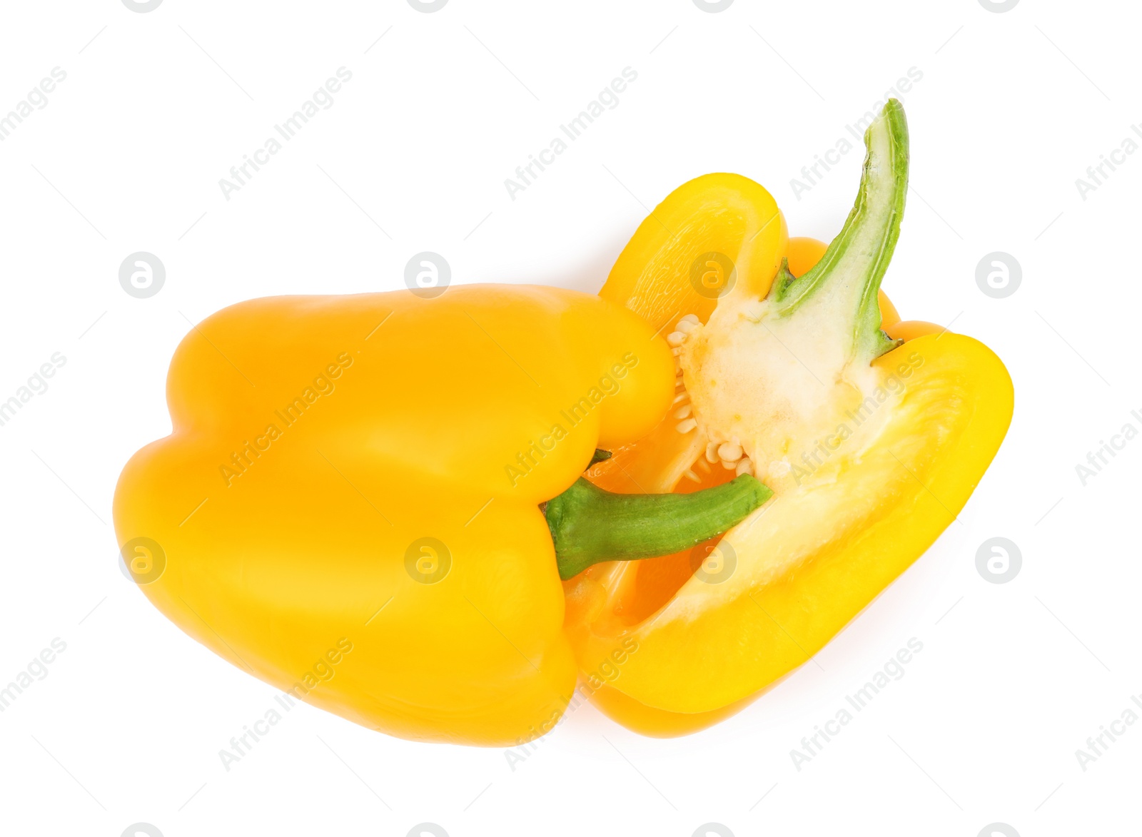 Photo of Halves of yellow bell pepper isolated on white, top view