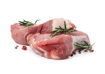 Fresh raw meat with rosemary and spices isolated on white