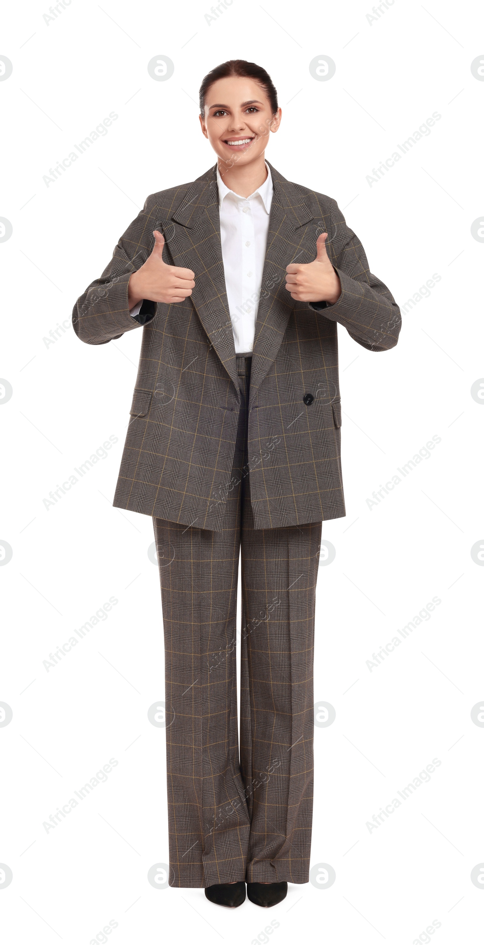 Photo of Beautiful businesswoman in suit showing thumbs up on white background