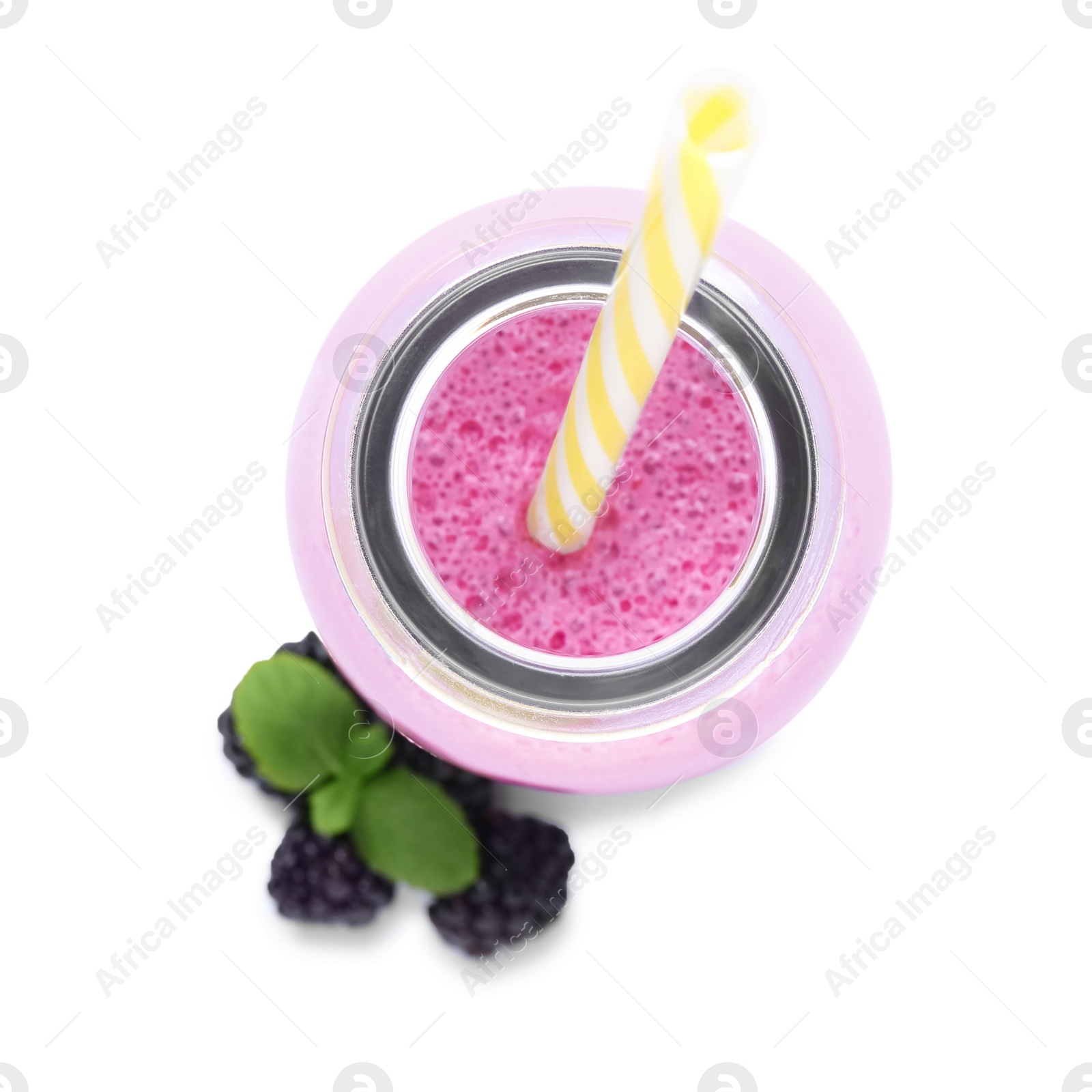 Photo of Glass bottle of blackberry smoothie with straw and berries on white background, top view