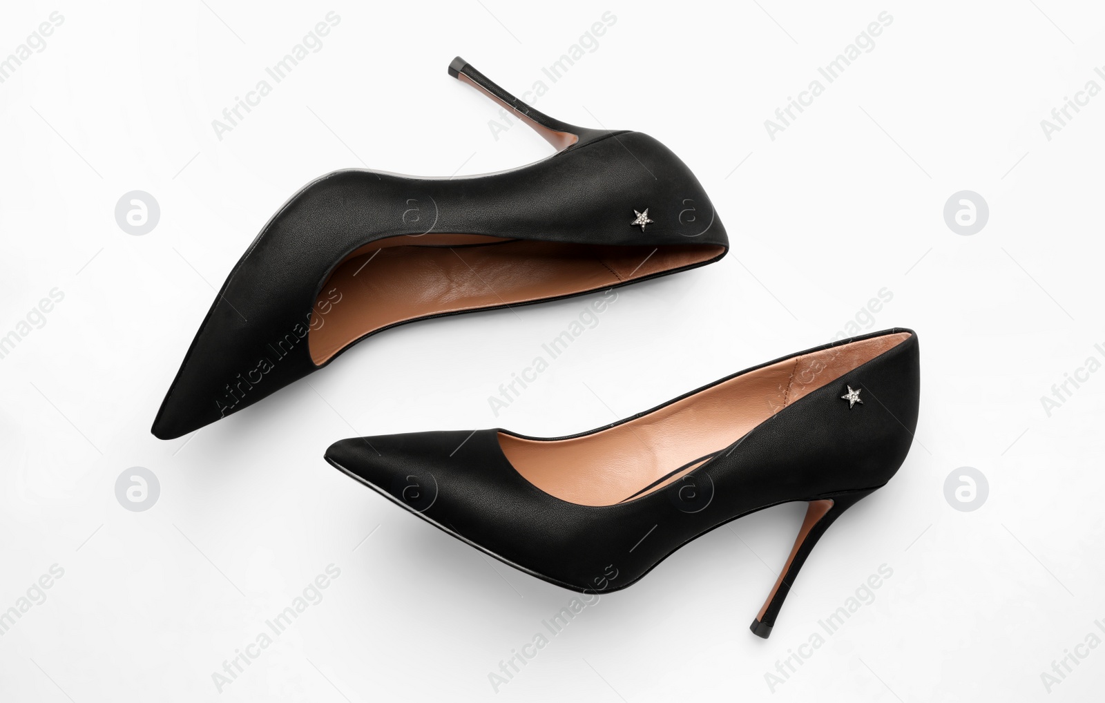 Photo of Pair of elegant black high heel shoes on white background, top view