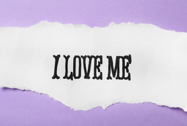 Photo of Paper with handwritten phrase I Love Me on violet background, top view