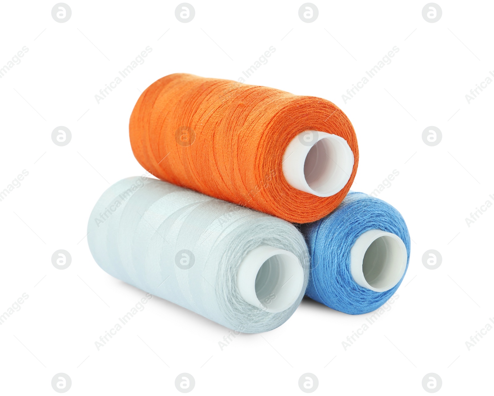 Photo of Different colorful sewing threads on white background