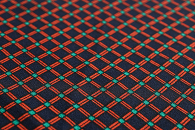 Photo of Texture of beautiful fabric with stylish pattern as background, closeup