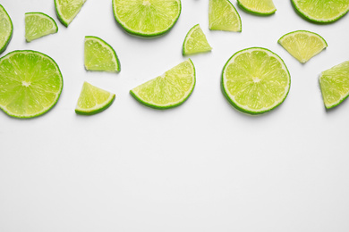 Photo of Juicy fresh lime slices on white background, top view