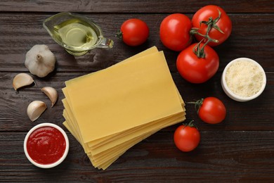 Ingredients for lasagna on wooden table, flat lay