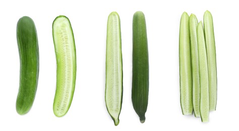 Image of Set with whole and cut ripe cucumbers on white background, top view