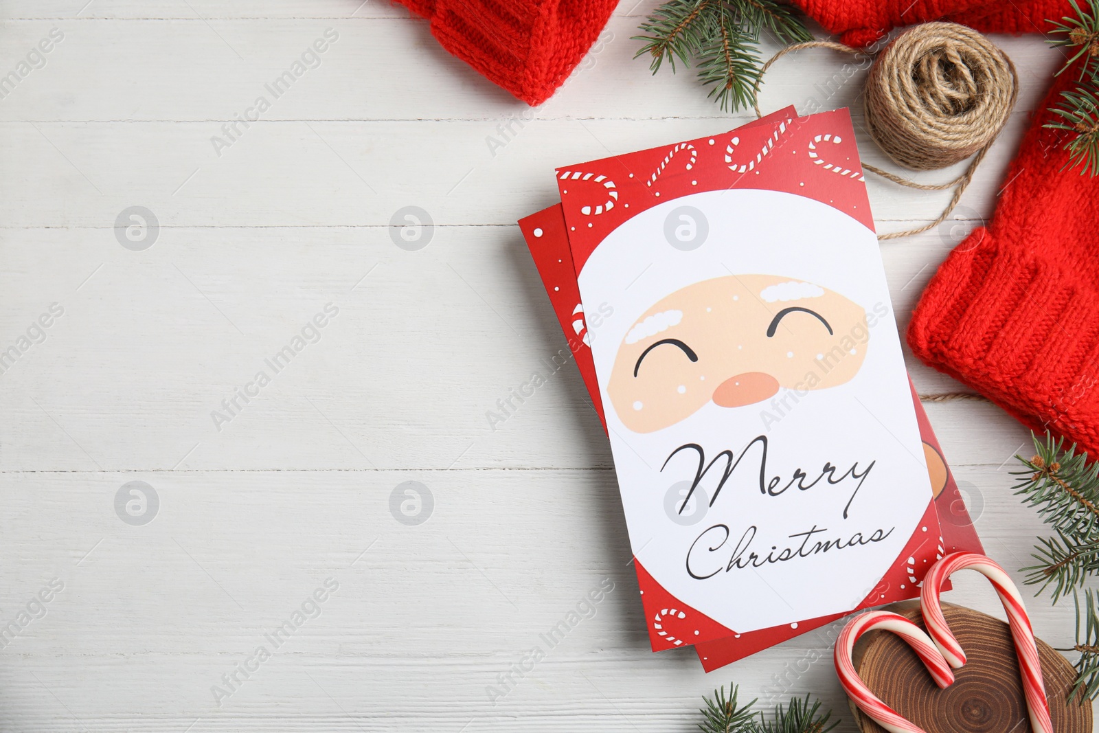 Photo of Flat lay composition with Christmas cards on white wooden background, space for text