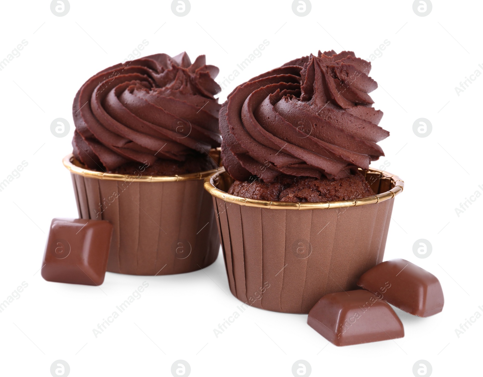Photo of Delicious cupcakes and chocolate pieces isolated on white