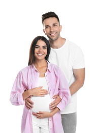 Happy young family holding pregnant belly on white background