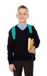 Photo of Portrait of cute boy in school uniform on white background